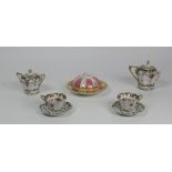 An attractive 19th Century German floral painted Tea Set, comprising tea cups and saucers, teapot,