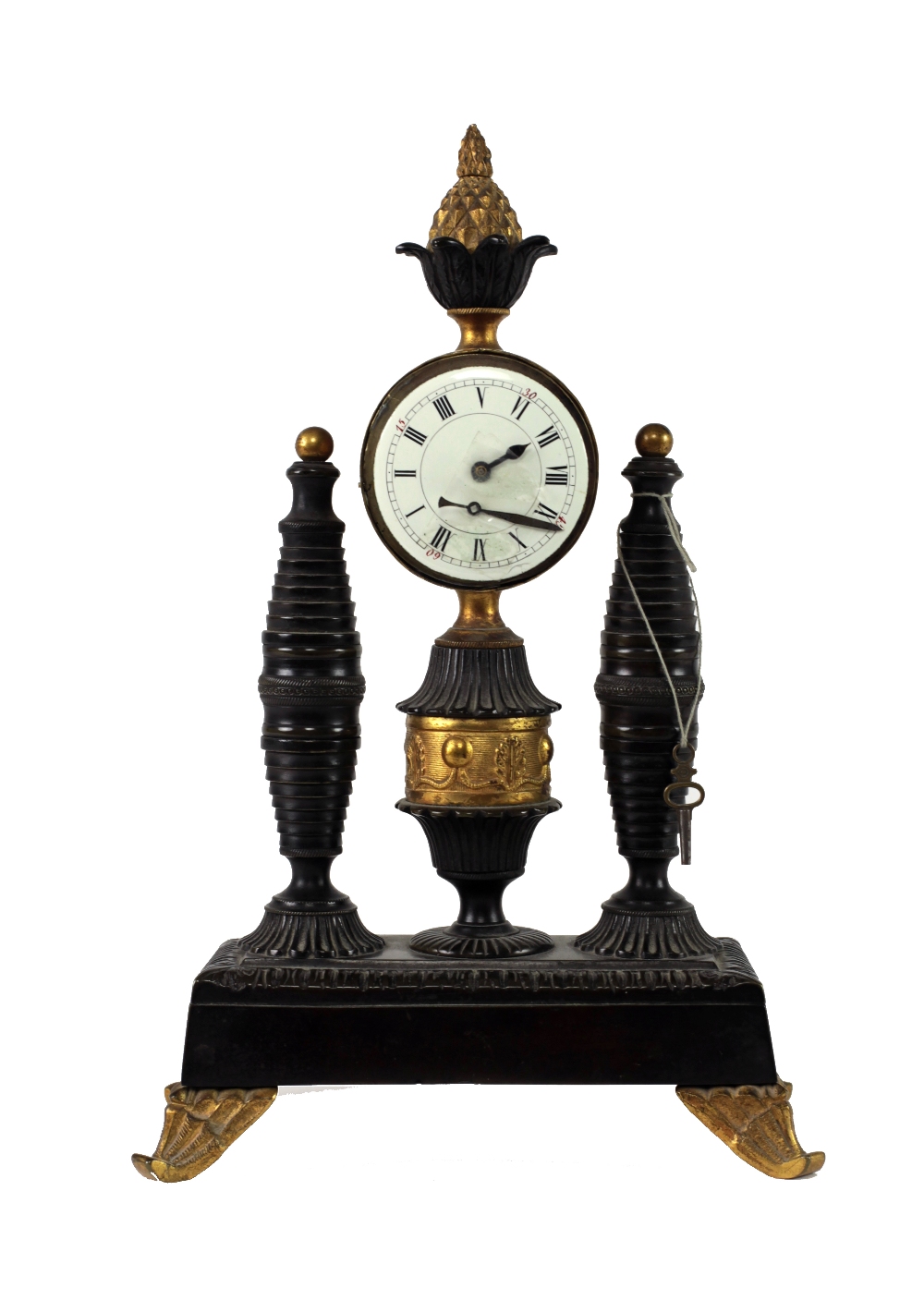 An early 19th Century Empire bronze Mantel Clock, the circular enamel dial with Roman numerals,