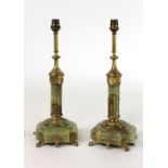 A fine quality pair of onyx marble pillar Lamps, with ormolu mounts,