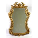 A late 18th / early 19th Century Italian rococo style Bolognese carved giltwood Mirror,