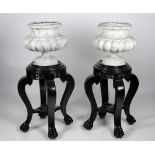 A pair of Oriental style ebonised Jardiniere Stands,