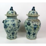 A pair of 18th Century style blue and white Chinese large octagonal Pots & Covers,