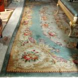 A fine quality woolen Chinese Carpet, with green centre panel on a green ground,