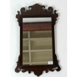 A small Georgian mahogany carved and decorated Wall Mirror, approx. 63cms x 37cm (25" x 14 1/2").