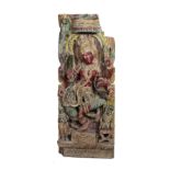 A large 19th Century Far Eastern heavy carved wooden Panel, decorated with large central figure,