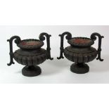 A large attractive pair of 19th Century two handled metal Urns, 41cms (16") high.
