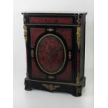 A 19th Century red boulle ebonised and brass inlaid single door Cabinet,