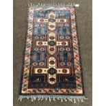 An unusual Oriental Rug, on blue ground,