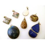 7 ASSORTED SILVER AND STONE PENDANTS