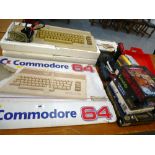 COMMODORE 64 WITH BOX,1530 DATASSETTE UNIT, DEFENDER 64 GUN, SPECTRAVIDEO JOYSTICK AND A QUANTITY OF