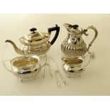 4 PIECE EPNS TEASET AND 2 PAIRS OF TONGS