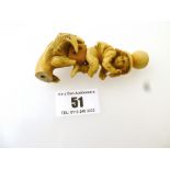 DAMAGED CARVED PIPE IN THE SHAPE OF A CLAW, DIE AND CHILD 3.5”