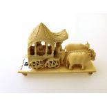 CARVED IVORY CARRIAGE ON STAND L: 5” H: 3.5”