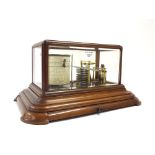 Good English walnut cased barograph, within a bevelled glazed case supported upon a triple stepped