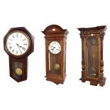 American Clock Co rosewood and mahogany two train 12" drop dial wall clock, within a turned ebonised