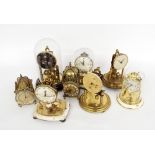 Six various small torsion clocks, also two miniature lantern clocks (8)