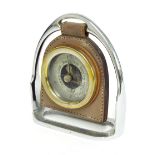 Small aneroid desk barometer, the 2.25" silvered dial with skeletonised centre within a metal casing