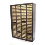 Wall cabinet consisting of ninety six steel drawers, suitable for storing watch and clock parts