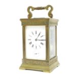 French brass alarm carriage clock striking on a gong, the white dial signed Guellier, Saumur above