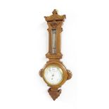 Small English oak barometer/thermometer, the 4.5" cream dial signed Lilley & Son, London, within a