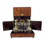 Victorian amboyna and mahogany liqueur decanter box of rectangular form, the double hinged lid