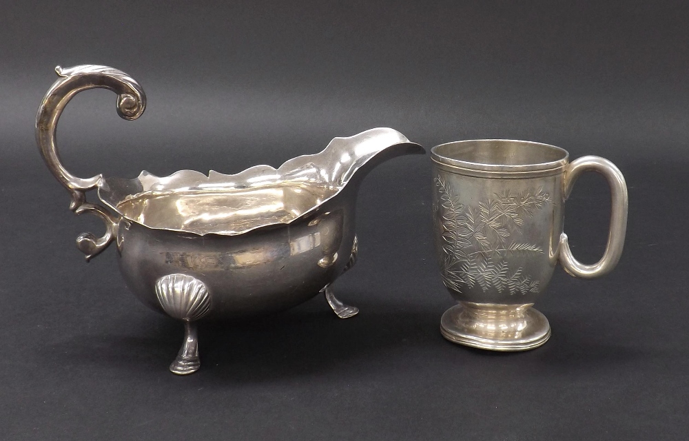 Georgian style silver cream jug with piecrust rim and scallop shell feet, hallmarks rubbed, 6" long;