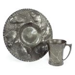 Arts & Crafts pewter dish embossed with fish upon a hammered ground with rippled rim, 12.25"