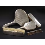 Collection of various silver dressing set items to include three brushes, mirror and comb, various