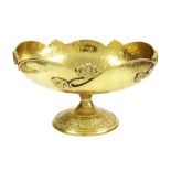 Art Nouveau style planished gilt metal pedestal fruit bowl, the rim cast with scrolled foliate