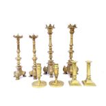 Four pairs of antique brass candlesticks, the largest 14.5" (8)