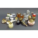 Collection of twenty-four table lighters to include American, glass, ceramic and metal examples (