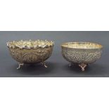 Two Continental '830' silver pedestal bowls, the smaller embossed with grapevine upon three