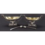 Pair of George III silver open oval twin handled pedestal salts, with gilt interiors and engraved