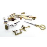 Antique sewing tools and accessories to include a polished brass sewing clamp in the form of a bird,