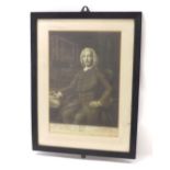 Black and white print of John Harrison pictured seated in a study, 15.5'' x 10.5'', glazed and