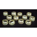 Set of twelve mother of pearl napkin rings, six inscribed with the letter 'S', the other six