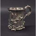 William IV silver christening mug embossed with scrolled foliage upon cast scallop shell feet, maker