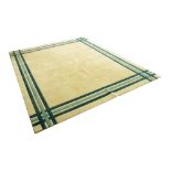 Large beige ground carpet with green shade borders, 143" wide approx