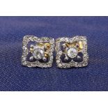 Pair of Victorian style diamond earrings, with square pierced settings in yellow and white gold, 0.