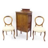 Mahogany bowfront cabinet, with a panel door upon slender legs, 23.5" wide