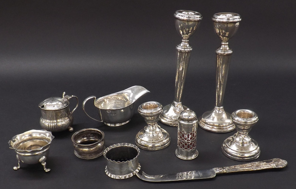 Mixed collection of antique and later silver to include two pairs of candlesticks, two napkin rings,