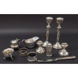 Mixed collection of antique and later silver to include two pairs of candlesticks, two napkin rings,