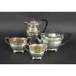 Silver four piece boat shaped tea service, with ebony handles comprising a teapot, water jug,