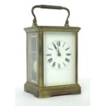 French carriage clock striking on a gong, within a corniche brass case, 7" high (key)