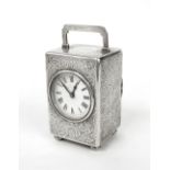 Edwardian silver cased carriage clock timepiece, the 2" white dial within a C-scroll and foliate