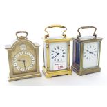 French carriage clock timepiece within a gilded pillared corniche style case, 6" high; also