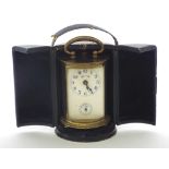 Miniature cylindrical carriage clock timepiece with alarm, 3.75" high; with outer folding Morocco