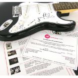 Genesis autographed Shine electric guitar, signed by Phil Collins, Mike Rutherford and Tony Banks to