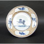 Chinese porcelain plate decorated in blue enamel with panels of birds within rouge de fer diaper