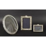 Continental oval white metal photograph frame, possibly Dutch, 9" high; together with two silver